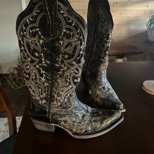 Black and brown women’s embroidered boots